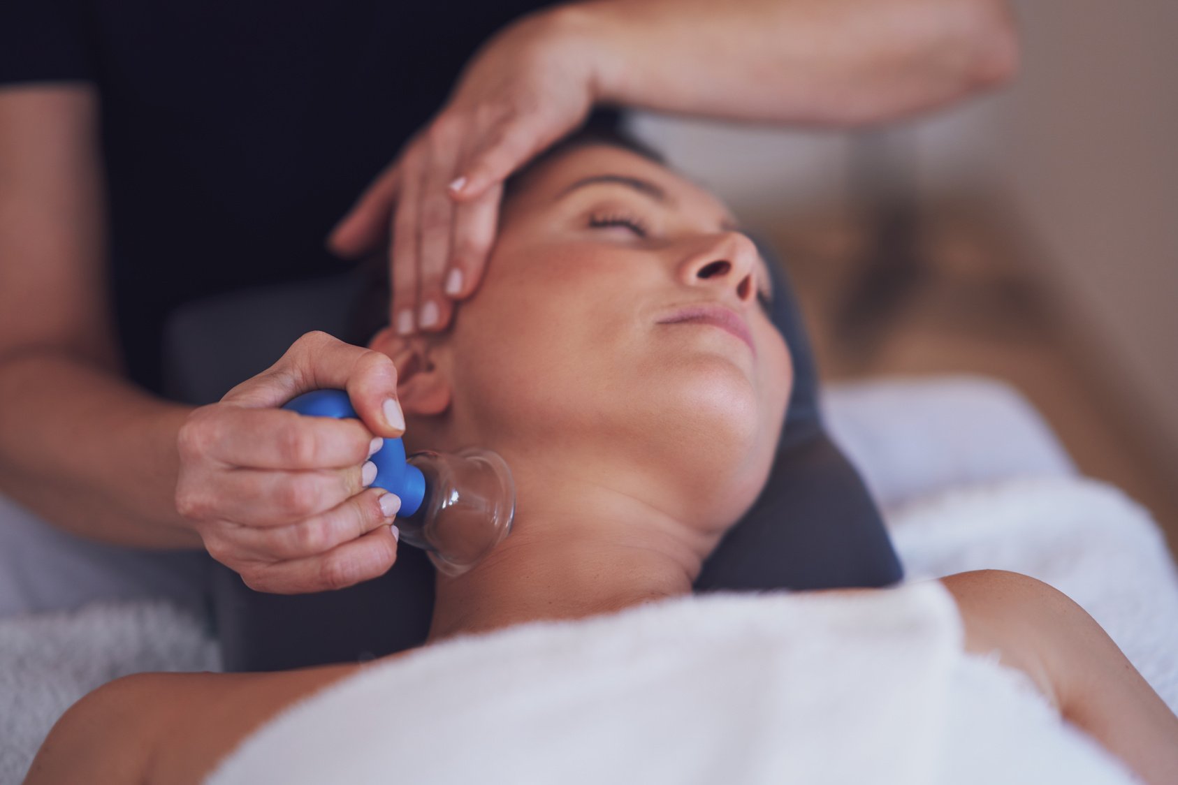 Woman Having a Face Cupping Massage in Salon